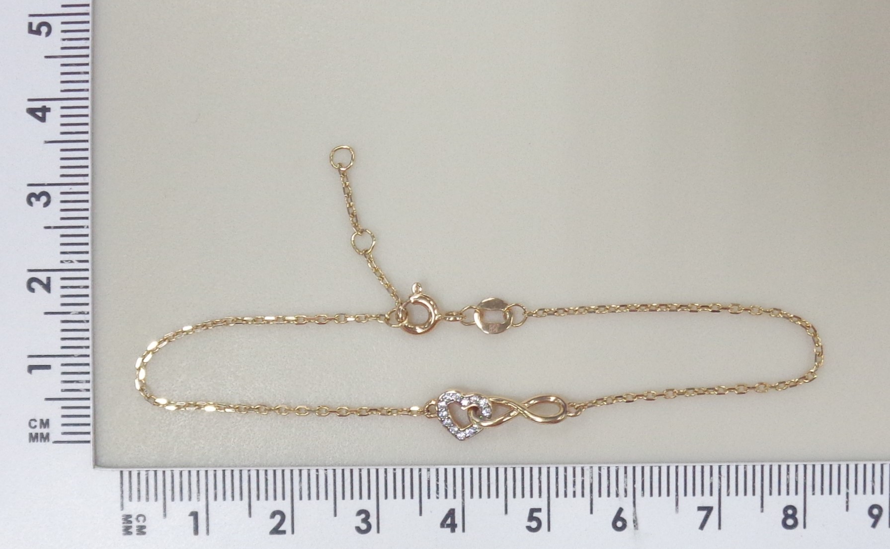 Золотой браслет 585 пробы; родий; плетение Якорное; вставки 14 Фианит бесцв.;